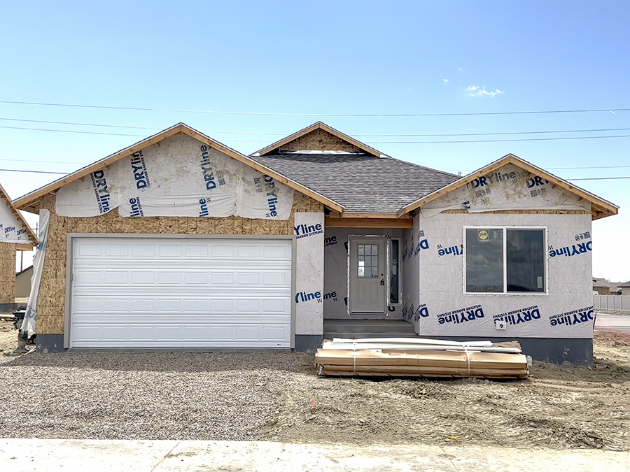 framed house with wrap in mustang ridge the Cochrane floor plan